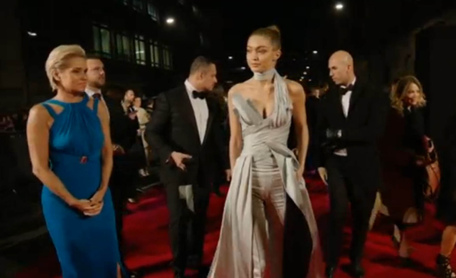 U.S. model Gigi Hadid and designer Ralph Lauren receive trophies at the 2016 Fashion Awards in London. (Photo courtesy to Reuters video)
