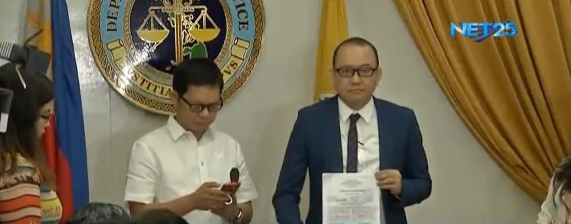File photo of Bureau of Immigration deputy commissioners Al Argosino and Michael Robles when they presented the P30 million that was left of the P50 million given to them allegedly as "bribe" by an associate of Chinese gambling tycoon Jack Lam.  They are now in hot water after the retired police official, Wally Sombero, who allegedly gave the money to them filed a graft complaint against the two before the Office of the Ombudsman for allegedly extorting money from Lam.  (Eagle News Service)