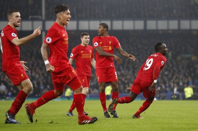 Britain Football Soccer - Everton v Liverpool - Premier League - Goodison Park - 19/12/16 Liverpool's Sadio Mane celebrates scoring their first goal with teammates   Action Images via Reuters / Carl Recine Livepic