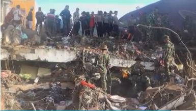 Search teams work with bare hands as intensive efforts to look for survivors continue in Aceh, Indonesia, after a quake that killed more than 100 people. (Photo courtesy of Reuters video file)