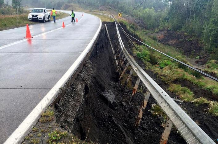 A damaged road is seen after a quake hit Chiloe island, southern Chile, December 25, 2016. REUTERS/Stringer