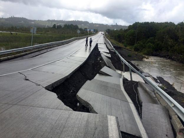 A damaged road is seen after a quake at Tarahuin, on Chiloe island, southern Chile, December 25, 2016. REUTERS/Alvaro Vidal