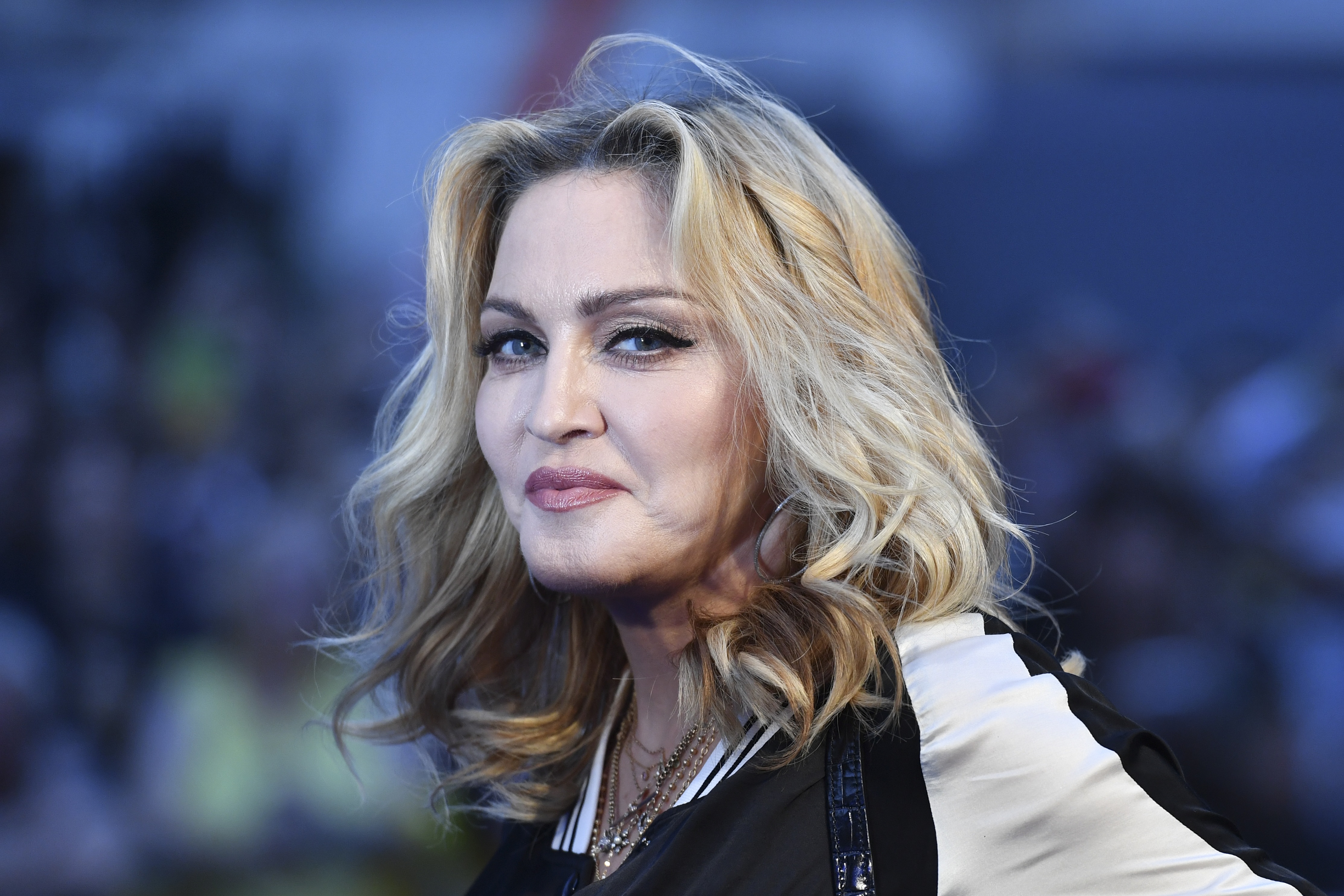 US singer-songwriter Madonna poses arriving on the carpet to attend a special screening of the film "The Beatles Eight Days A Week: The Touring Years" in London on September 15, 2016. / AFP PHOTO / Ben STANSALL