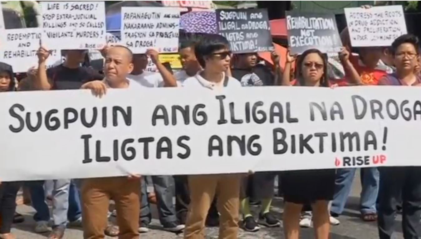 Activists stage a rally against indiscriminate killings of drug abuse victims ahead of Human Rights Day, December 10. (Photo grabbed from Reuters video)
