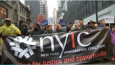 On International Migrants Day, the New York Immigration Coalition rally in against President-Elect Trump. (Photo grabbed from Reuters video file)