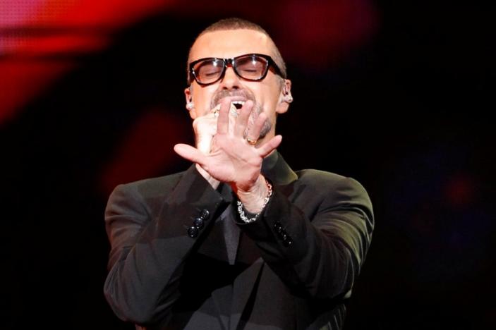 FILE PHOTO British singer George Michael performs on stage during his "Symphonica" tour concert in Berlin September 5, 2011. REUTERS/Tobias Schwarz/File photo