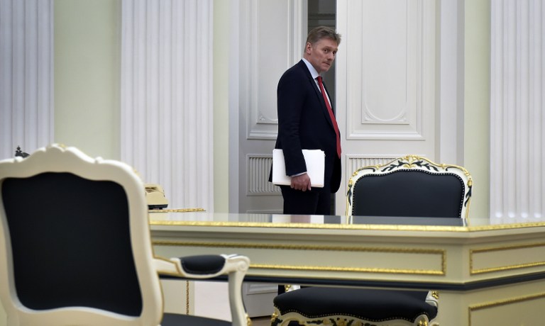 A picture taken on March 24, 2016 shows Kremlin spokesman Dmitry Peskov entering a hall at the Kremlin in Moscow. Dmitry Peskov (born October 17, 1967) is a Russian diplomat, and since 2012 the press spokesman for the President of Russia, Vladimir Putin. / AFP PHOTO / ALEXANDER NEMENOV