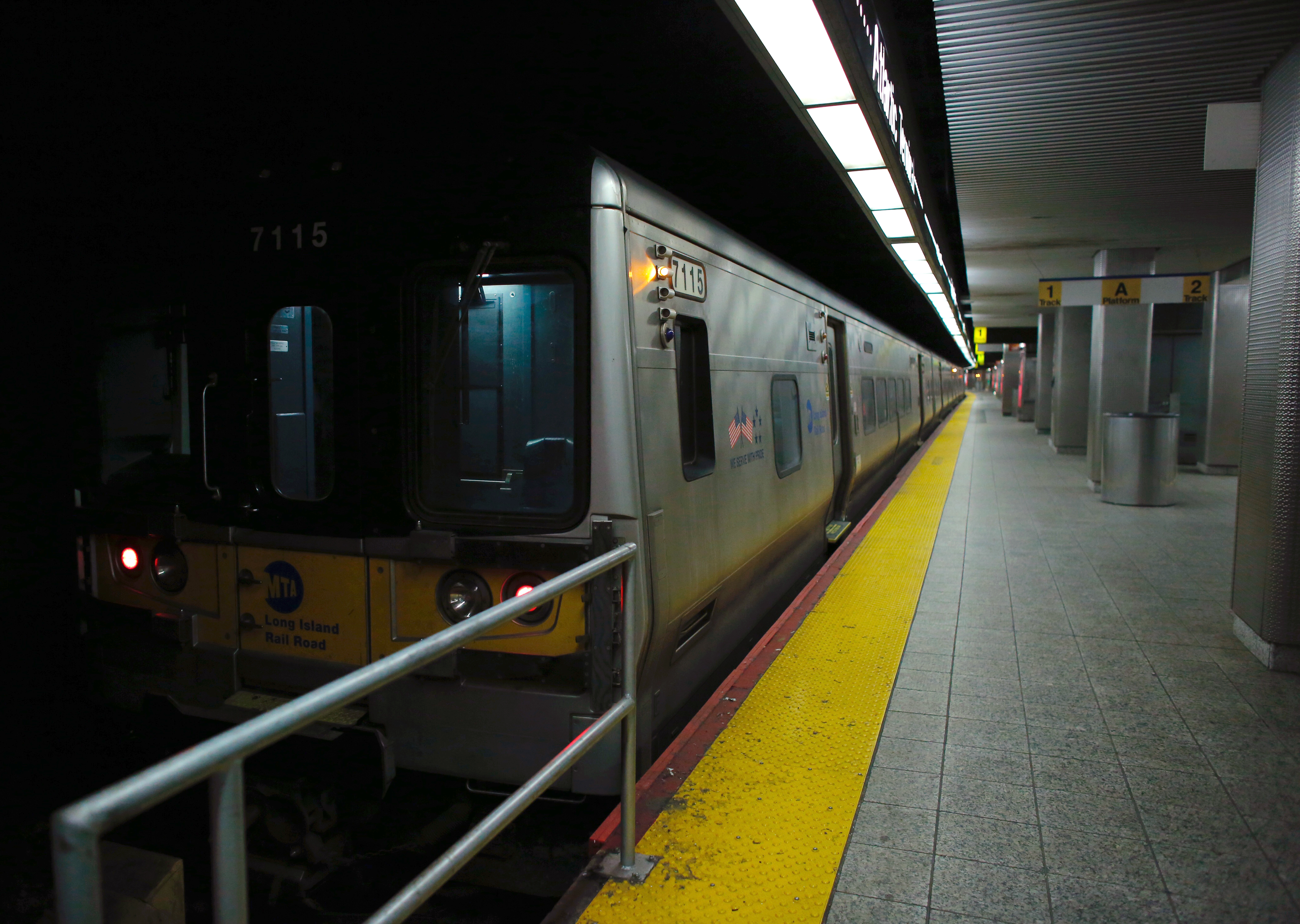 A Long Island Rail Road train is seen on the track inside the Atlantic Terminal January 4, 2017 in the Brooklyn borough of New York. A commuter train derailed Wednesday at a station in Brooklyn and injured nearly 80 people, officials said, setting off a panic during the morning rush. The Long Island Rail Road train crashed around 8:30 am (1330 GMT) at Atlantic Terminal in the heart of the New York borough."76 non life-threatening injuries reported at scene of LIRR train derailment, Atlantic Terminal Brooklyn," the New York Fire Department said in a tweet. / AFP PHOTO / Kena Betancur