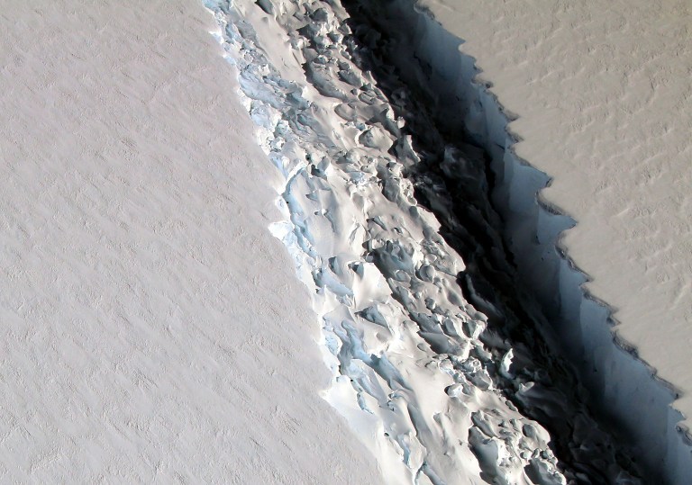 (FILES) This file photo released on December 1, 2016 by NASA shows what scientists on NASA's IceBridge mission photographed in a view of a massive rift in the Antarctic Peninsula's Larsen C ice shelf on November 10, 2016.  A massive ice block nearly 100 times the area of Manhattan is poised to break off Antarctica's Larsen C ice shelf, scientists reported on January 6, 2017. A slow-progressing rift suddenly grew by 18 kilometres (11 miles) at the end of December, leaving the finger-shaped chunk -- 350 metres thick -- connected along only a small fraction of its length. The rift has also widened, from less than 50 metres (160 feet) in 2011 to nearly 500 metres today.  / AFP PHOTO / NASA / NASA/Maria-Jose VINAS / RESTRICTED TO EDITORIAL USE - MANDATORY CREDIT AFP PHOTO /NASA/Maria-Jose Vinas  - NO MARKETING - NO ADVERTISING CAMPAIGNS - DISTRIBUTED AS A SERVICE TO CLIENTS