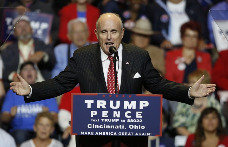 (FILES) This file photo taken on October 13, 2016 shows former mayor of New York City Rudy Giuliani speaking at a Republican presidential candidate Donald Trump campaign rally at the US Bank Arena in Cincinnati, Ohio. Donald Trump on January 12, 2017 tapped former New York mayor Rudy Giuliani to advise his incoming administration on cyber security following outcry over Russian hackers' apparent attempt to meddle in the election. Giuliani, 72, dubbed America's mayor for his leadership in the wake of the 9/11 attacks, said last month he had taken himself out of the running for a cabinet job after coming under scrutiny in the US media over business dealings that could post conflicts of interest. / AFP PHOTO / David Kohl