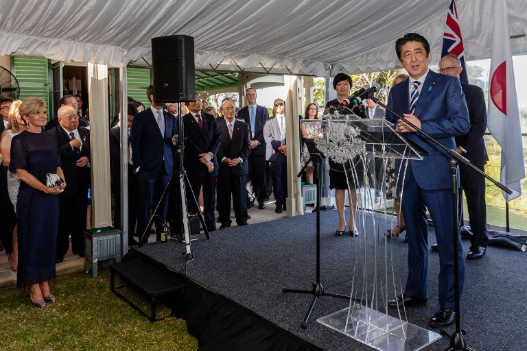 Japan's Prime Minister Shinzo Abe speaks, as his wife Akie (3rd R), Australia's Prime Minister Malcolm Turnbull (R) and Foreign Minister Julie Bishop (L) listen, during a reception at Kirribilli House in Sydney on January 14, 2017. Japan and Australia will work together to ensure the Trans-Pacific Partnership free trade deal comes into force, Prime Minister Shinzo Abe said on January 14, making no mention of strong US opposition. / AFP PHOTO / POOL / Brook Mitchell