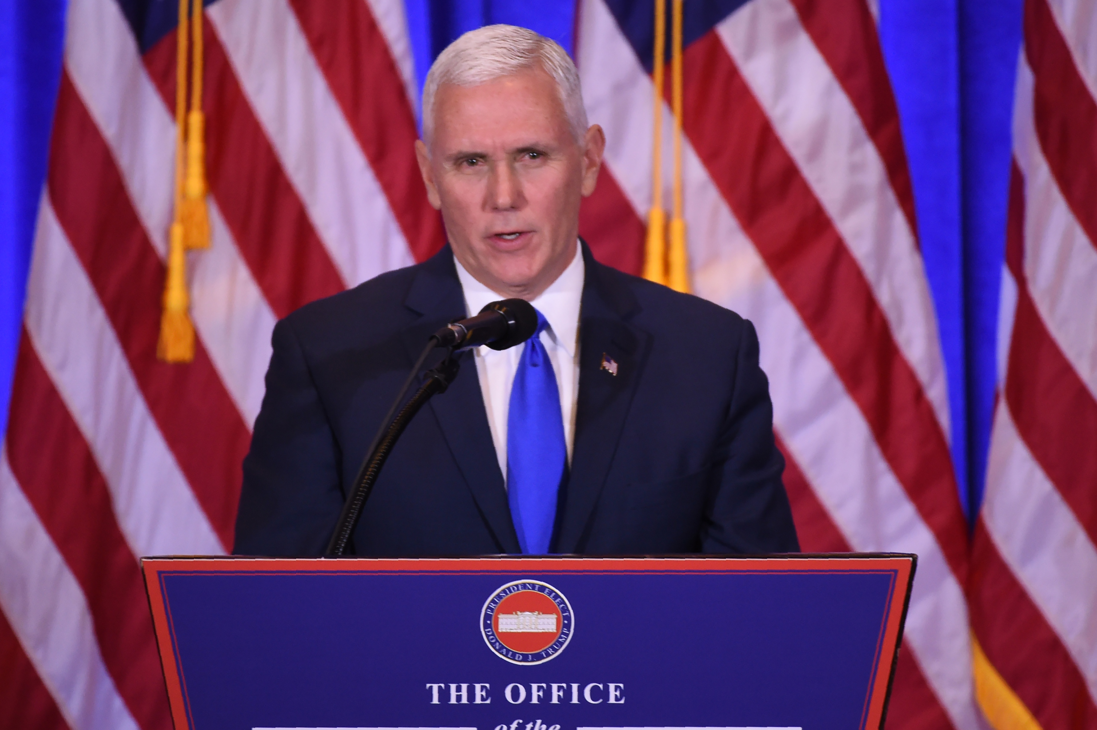 (FILES) This file photo taken on January 11, 2017 shows US Vice President-elect Mike Pence speaks during a press conference January 11, 2017 in New York. A feud between Donald Trump and a prominent civil rights icon ramped up January 15, 2017, as Vice president-elect Mike Pence jumped to his boss's defense while a growing number of Democrats vowed to skip the upcoming inauguration. Pence said he was "deeply disappointed" in longtime Congressman John Lewis's decision to boycott Trump's inauguration. / AFP PHOTO / DON EMMERT