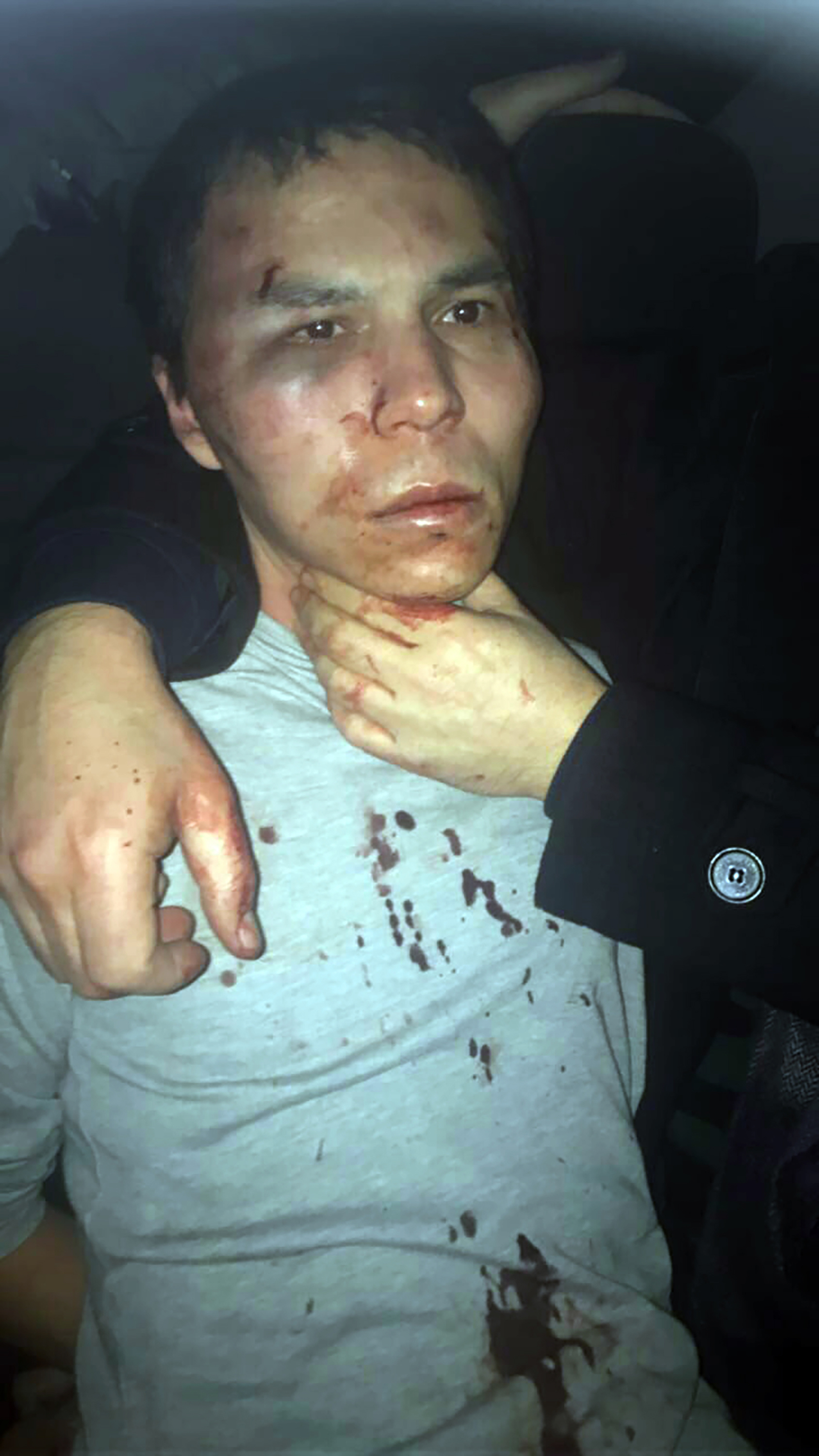 This handout picture released by the Turkish police and taken from Dogan News Agency on January 16, 2017 shows the main suspect in the Reina nightclub rampage captured by Turkish police after a gunman killed 39 people, including many foreigners, in an attack at an upmarket nightclub in Istanbul where revellers were celebrating the New Year.  Turkish police late on January 16, 2017 caught the attacker who shot dead 39 people on New Year's night at an Istanbul nightclub, state-run TRT television reported. The alleged attacker was found along with his four-year-old son in an apartment in the Esenyurt district of Istanbul after a massive police operation, TRT reported.  / AFP PHOTO / DOGAN NEWS AGENCY / Handout /  - Turkey OUT / RESTRICTED TO EDITORIAL USE - MANDATORY CREDIT "AFP PHOTO / DOGAN NEWS AGENCY / TURKISH POLICE" - NO MARKETING NO ADVERTISING CAMPAIGNS - DISTRIBUTED AS A SERVICE TO CLIENTS