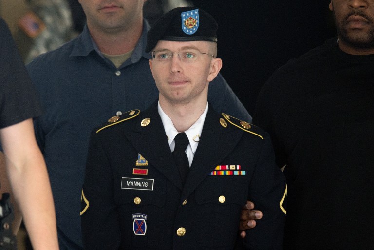 (FILES) This file photo taken on July 30, 2013 shows US Army Private First Class Bradley Manning leaving a military court facility after hearing his verdict in the trial at Fort Meade, Maryland. US President Barack Obama commuted the sentence of Manning a transgender woman now known as Chelsea Manning, who is serving 35 years behind bars for leaking classified US documents, the White House said January 17, 2017.  / AFP PHOTO / SAUL LOEB