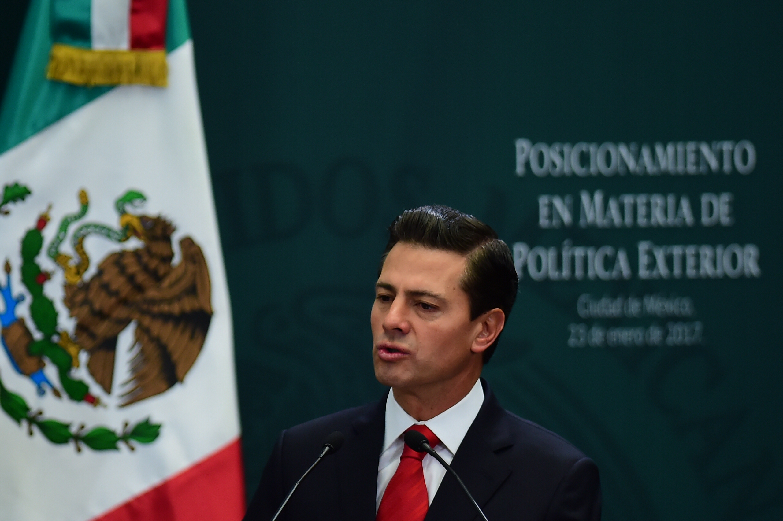 Mexican President Enrique Pena Nieto gives a foreign policy speech after US President Donald Trump vowed to start renegotiating North American trade ties, in Mexico City on January 23, 2017. Trump's vows to scrap the North American Free Trade Agreement to protect US jobs have raised concern in Mexico, which sends most of its exports to the United States. Pena Nieto's office said he congratulated Trump on taking office in a phone call Saturday and that both had agreed to open a "new dialogue." / AFP PHOTO / Ronaldo SCHEMIDT