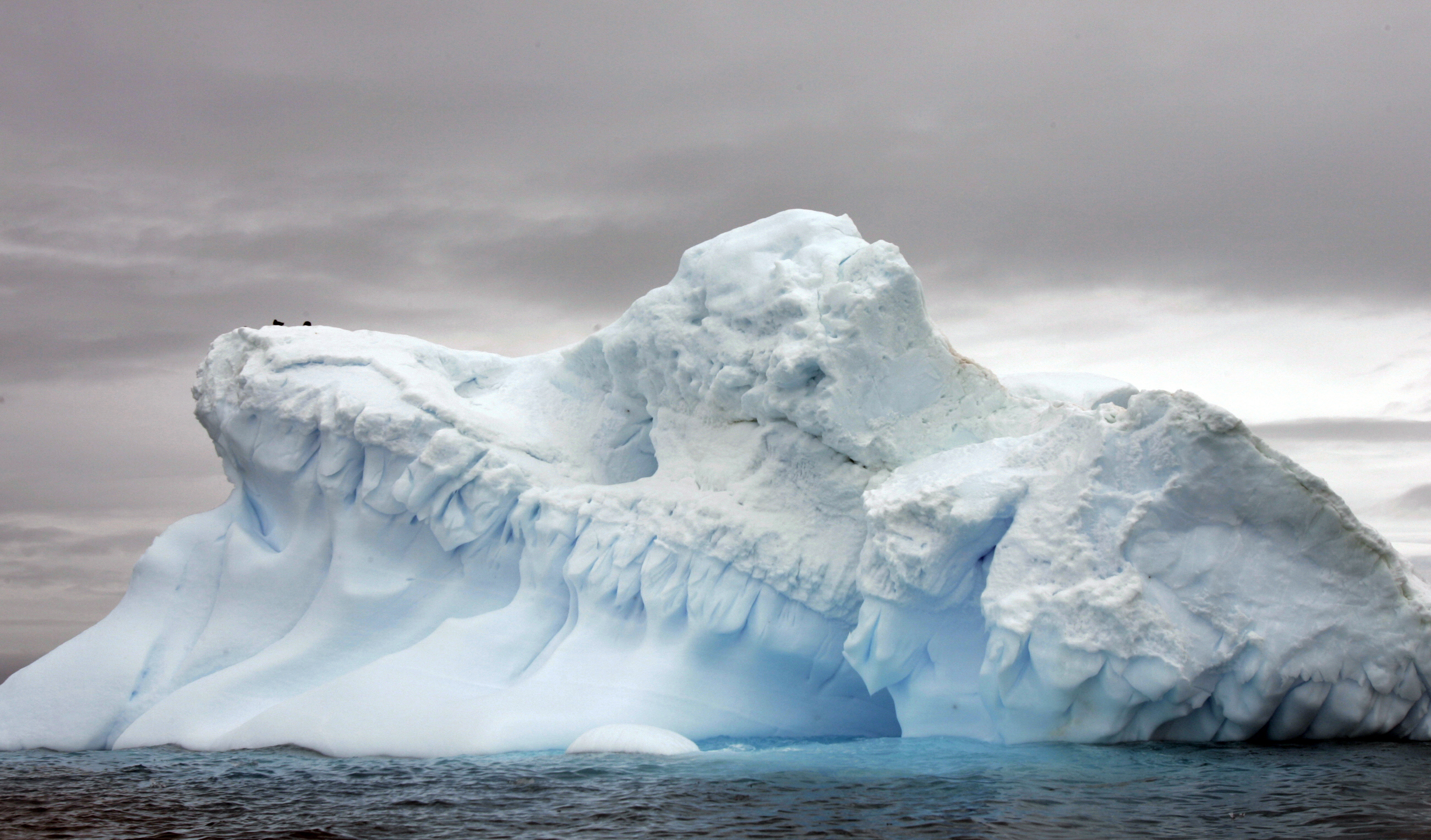 (FILES) This file photo taken on November 9, 2007 shows a glacier in Antarctica. In the last days of Barack Obama's administration, US government scientists warned even more sea level rise is expected by century's end than previously estimated, due to rapid ice sheet melting at the poles. The report by the National Oceanic and Atmospheric Administration (NOAA) set the "extreme" scenario of global average sea level rise by 2100 to 8.2 feet (2.5 meters), up half a meter from the last estimate issued in 2012. The figures are among the highest ever issued by the US government, and take into account new scientific studies on the disappearing ice cover in Greenland and Antarctica."Recent (scientific) results regarding Antarctic ice sheet instability indicate that such outcomes may be more likely than previously thought," said the report, released on January 19, 2017.  / AFP PHOTO / RODRIGO ARANGUA