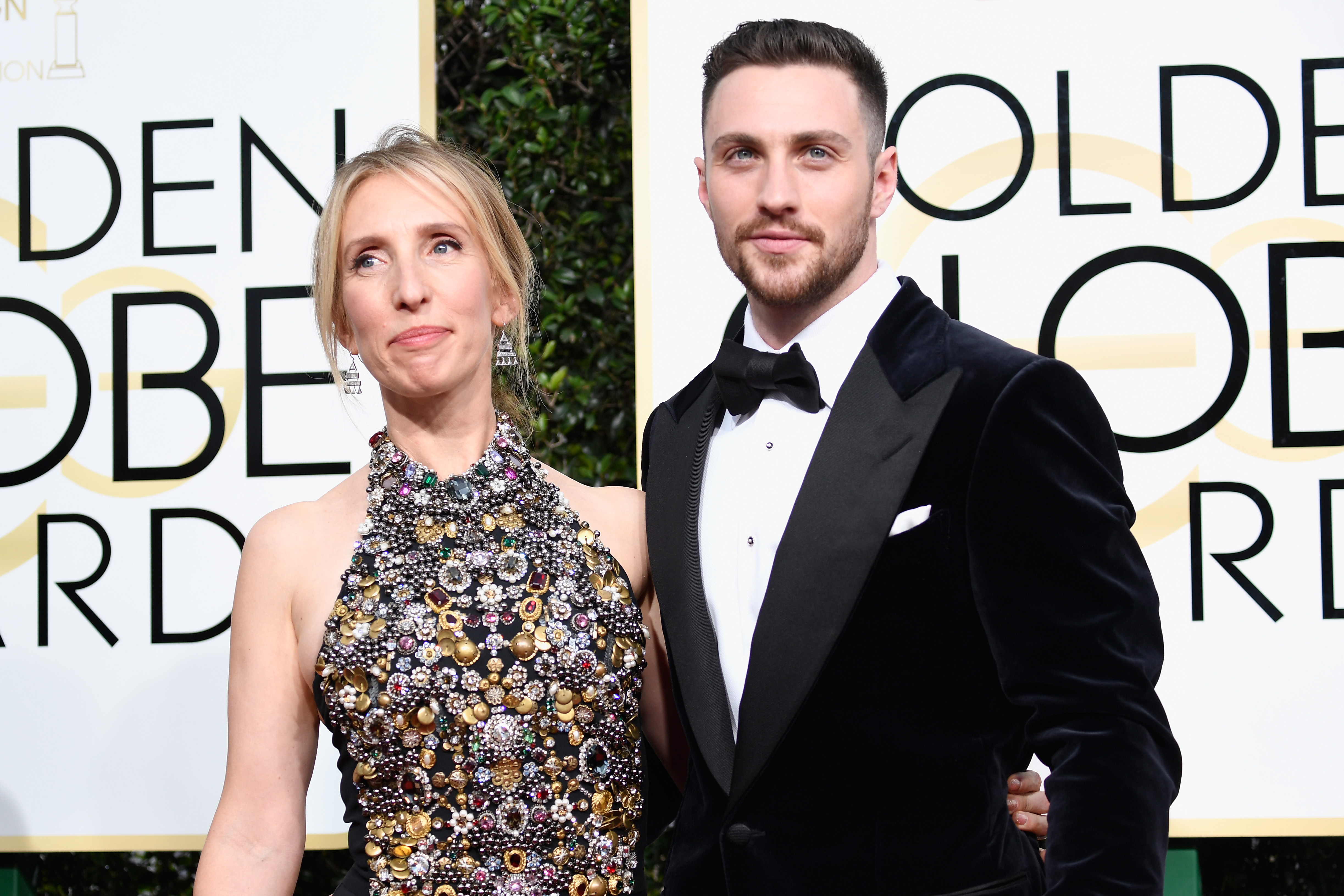 BEVERLY HILLS, CA - JANUARY 08: Director Sam Taylor-Johnson (L) and actor Aaron Taylor-Johnson attends the 74th Annual Golden Globe Awards at The Beverly Hilton Hotel on January 8, 2017 in Beverly Hills, California. Frazer Harrison/Getty Images/AFP