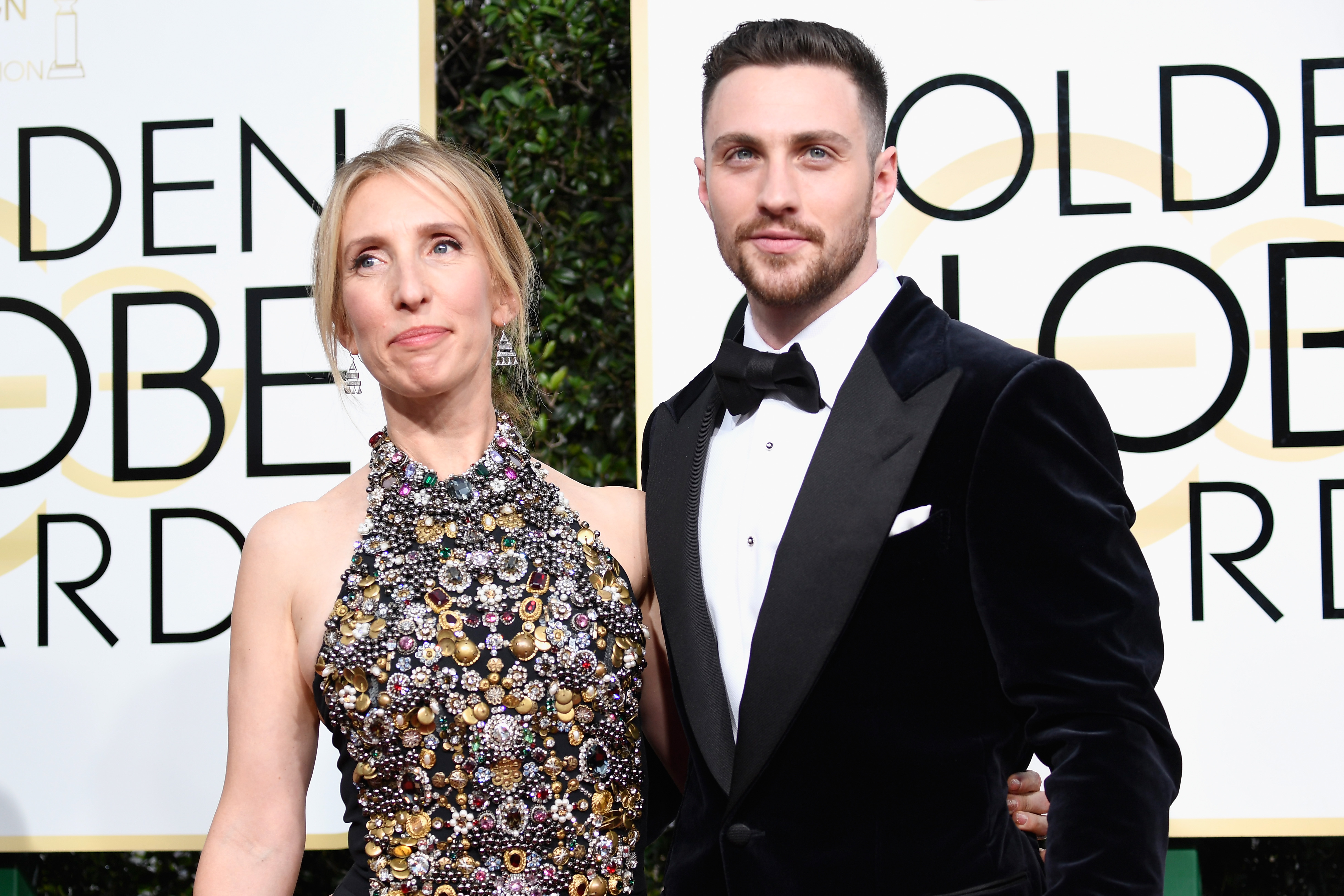BEVERLY HILLS, CA - JANUARY 08: Director Sam Taylor-Johnson (L) and actor Aaron Taylor-Johnson attends the 74th Annual Golden Globe Awards at The Beverly Hilton Hotel on January 8, 2017 in Beverly Hills, California.   Frazer Harrison/Getty Images/AFP