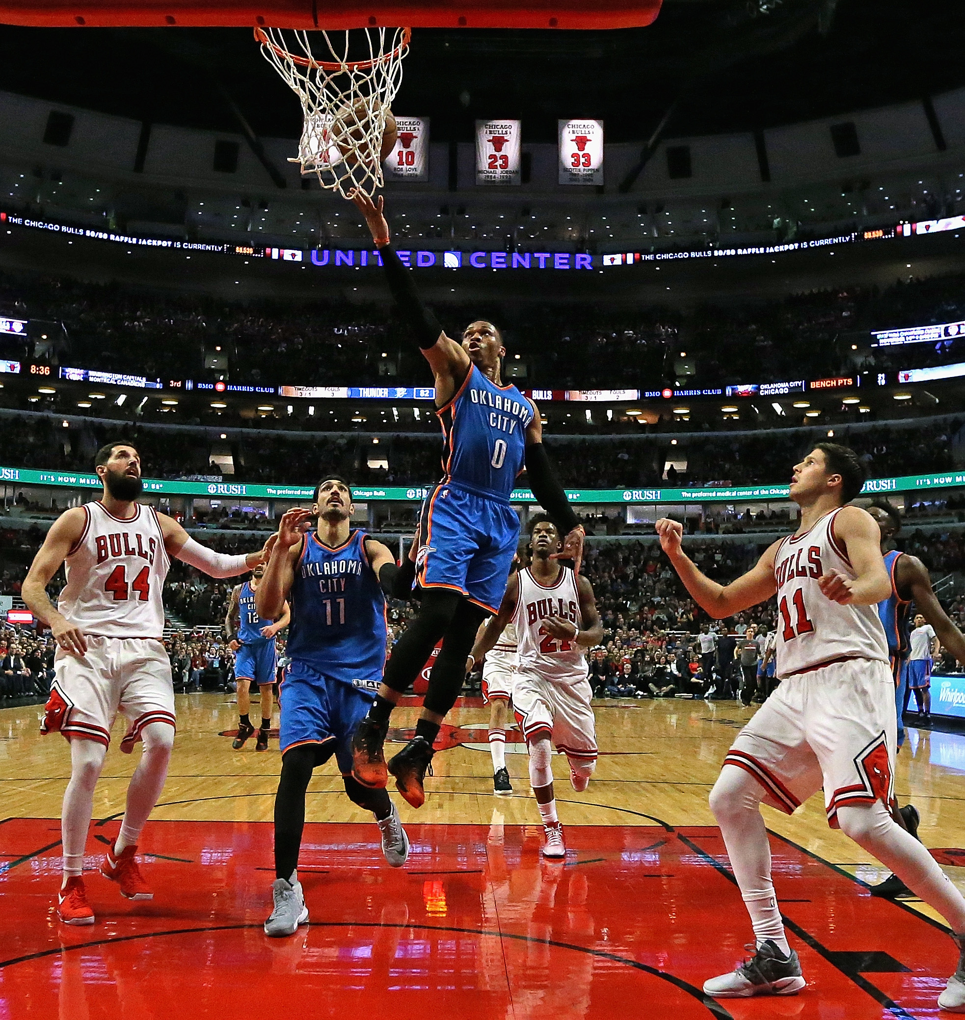 CHICAGO, IL - JANUARY 09: Russell Westbrook #0 of the Oklahoma City Thunder drives the lane between Nikola Mirotic #44 and Doug McDermott #11 of the Chicago Bulls at the United Center on January 9, 2017 in Chicago, Illinois. The Thunder defeated the Bulls 109-94. NOTE TO USER: User expressly acknowledges and agrees that, by downloading and/or using this photograph, user is consenting to the terms and conditions of the Getty Images License Agreement.   Jonathan Daniel/Getty Images/AFP