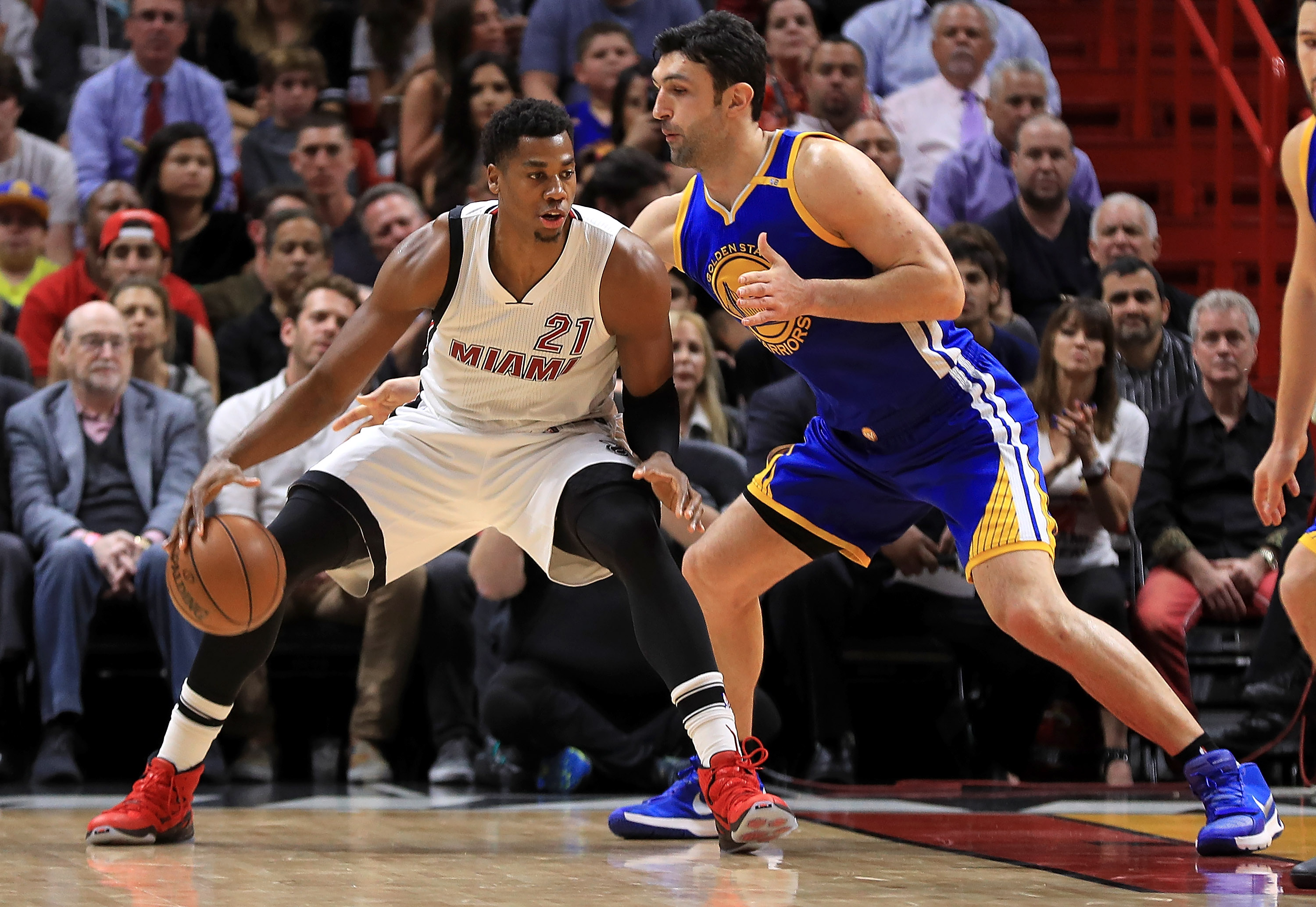 MIAMI, FL - JANUARY 23: Hassan Whiteside #21 of the Miami Heat posts up Zaza Pachulia #27 of the Golden State Warriors during a game at American Airlines Arena on January 23, 2017 in Miami, Florida. NOTE TO USER: User expressly acknowledges and agrees that, by downloading and or using this photograph, User is consenting to the terms and conditions of the Getty Images License Agreement.   Mike Ehrmann/Getty Images/AFP