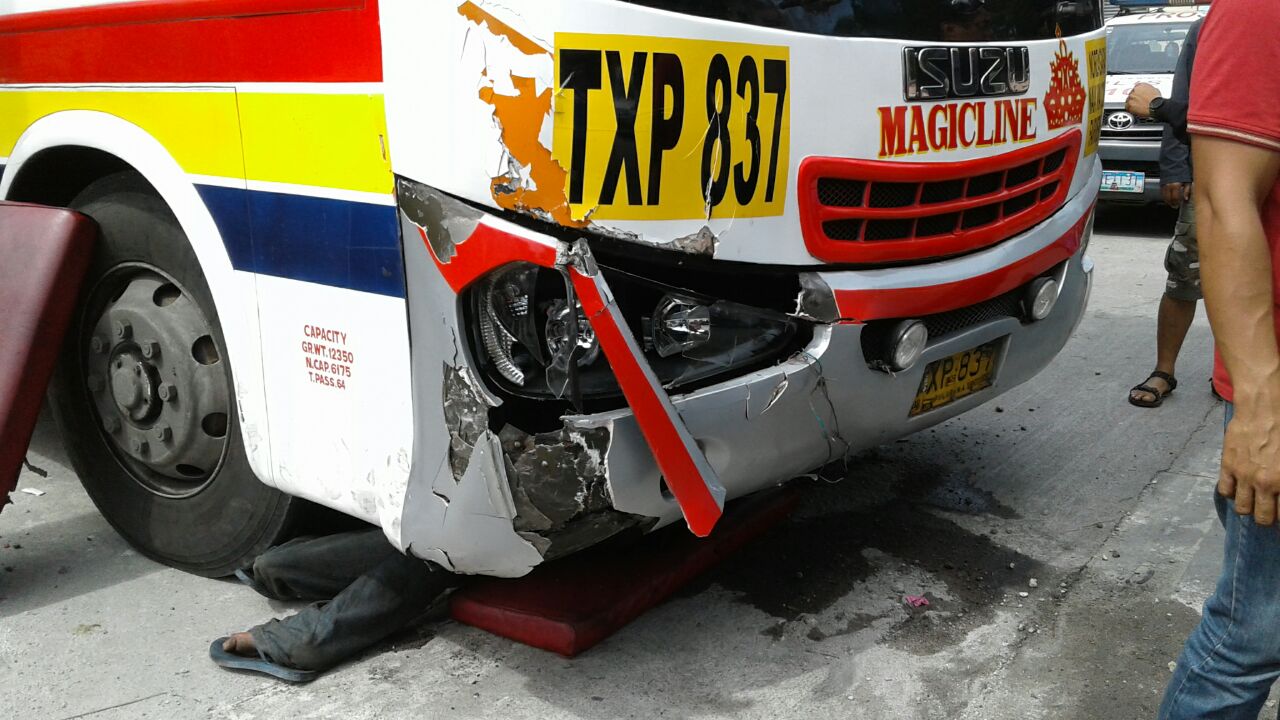 The Magic Line bus being inspected. The company has yet to provide assistance to the victim's family.