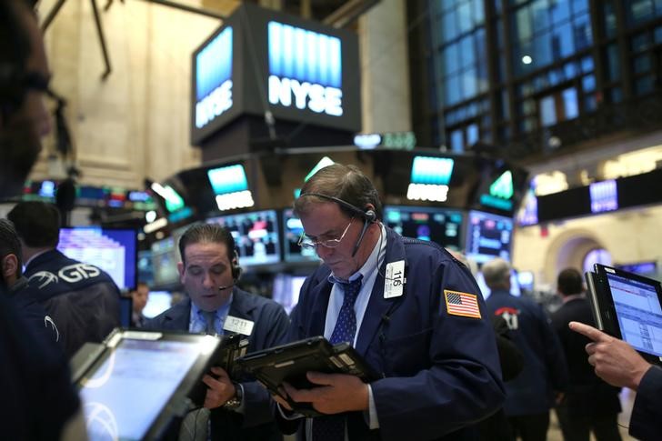 Traders work on the floor of the New York Stock Exchange (NYSE) in Manhattan, New York City, U.S., January 19, 2017. REUTERS/Stephen Yang