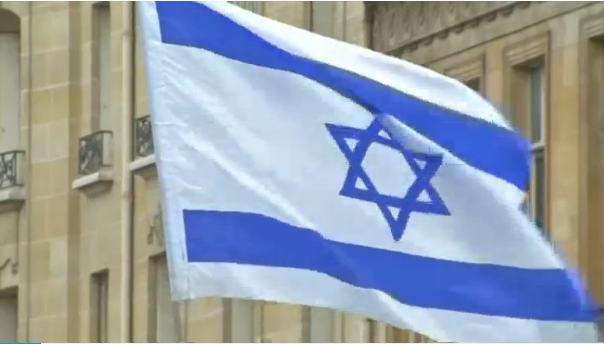 Several hundred pro-Israeli demonstrators protest outside the Israeli embassy in Paris against what they say is 'pointless' Middle East summit.(photo grabbed from Reuters video) 