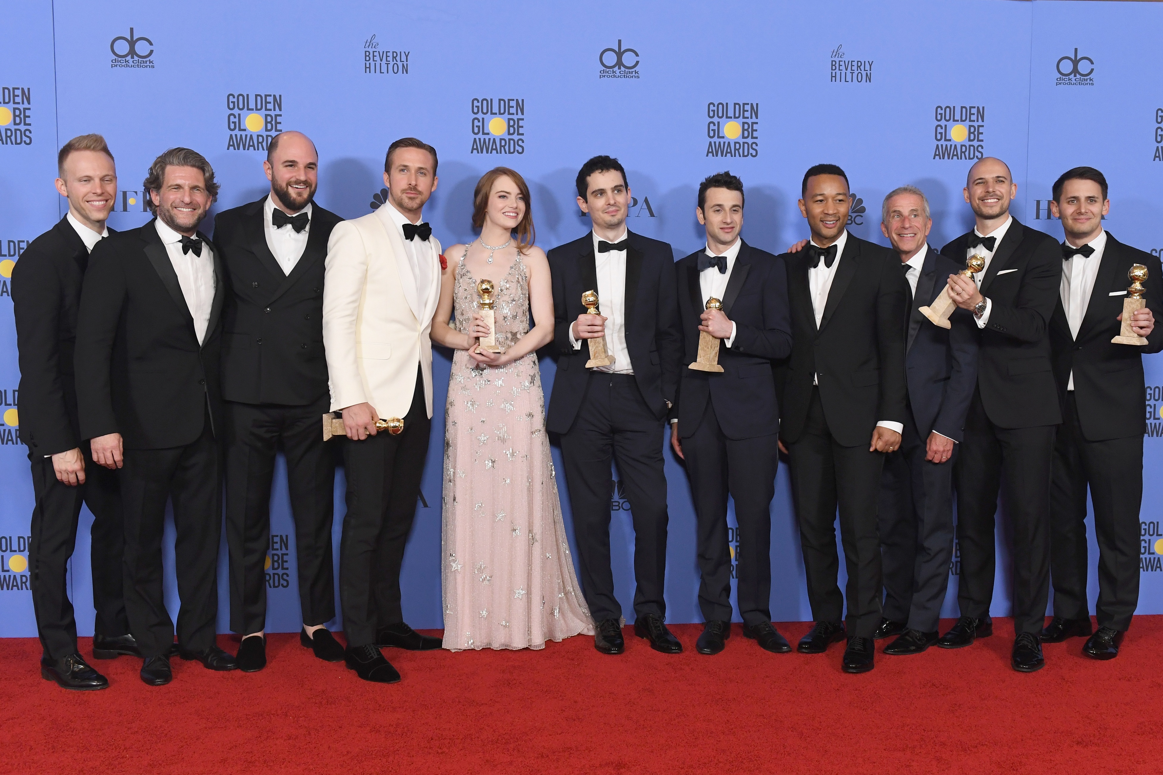 BEVERLY HILLS, CA - JANUARY 08: Cast and crew of 'La La Land,' winners of Best Motion Picture - Musical or Comedy, pose in the press room during the 74th Annual Golden Globe Awards at The Beverly Hilton Hotel on January 8, 2017 in Beverly Hills, California.   Kevin Winter/Getty Images/AFP