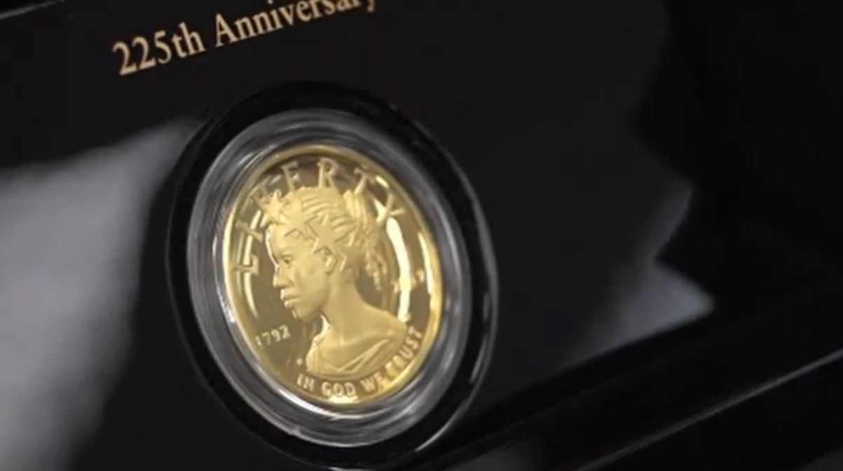 The United States Mint unveils a $100 gold coin featuring an African-American woman as the face of Lady Liberty for the first time in the history of U.S. currency. (Photo grabbed from Reuters video)
