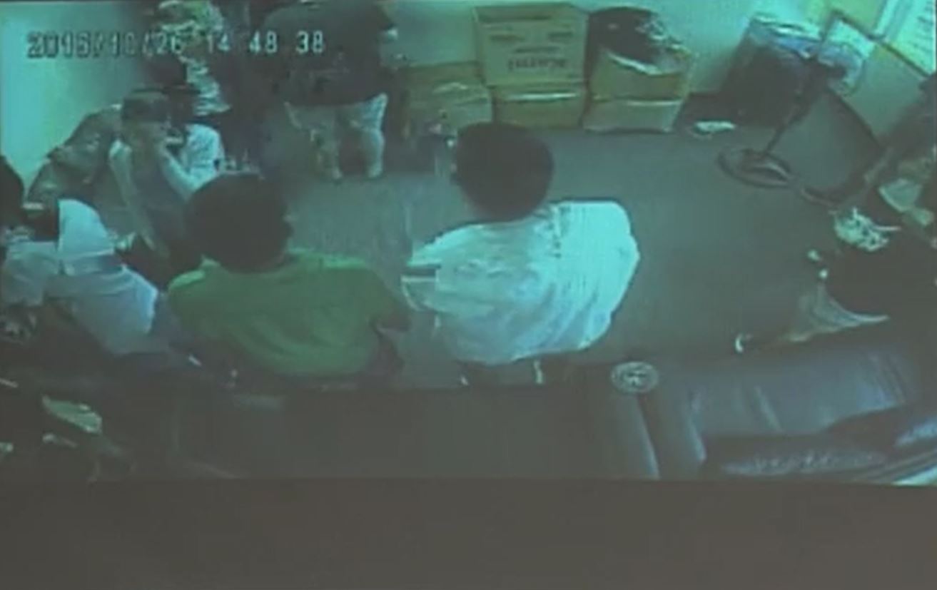 The same October 26, 2016 alleged police raid where the office workers were rushed into another room. (photo grabbed from CCTV video played during Senate hearing)