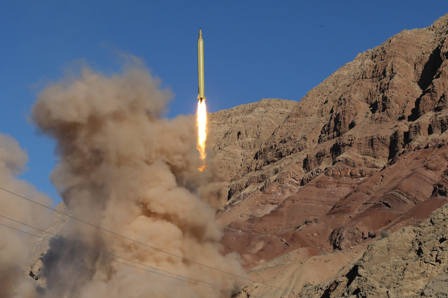 A long-range Qadr ballistic missile is launched in the Alborz mountain range in northern Iran on March 9, 2016. Iran said its armed forces had fired two more ballistic missiles as it continued tests in defiance of US warnings.  / AFP PHOTO / TASNIM NEWS / Mahmood Hosseini