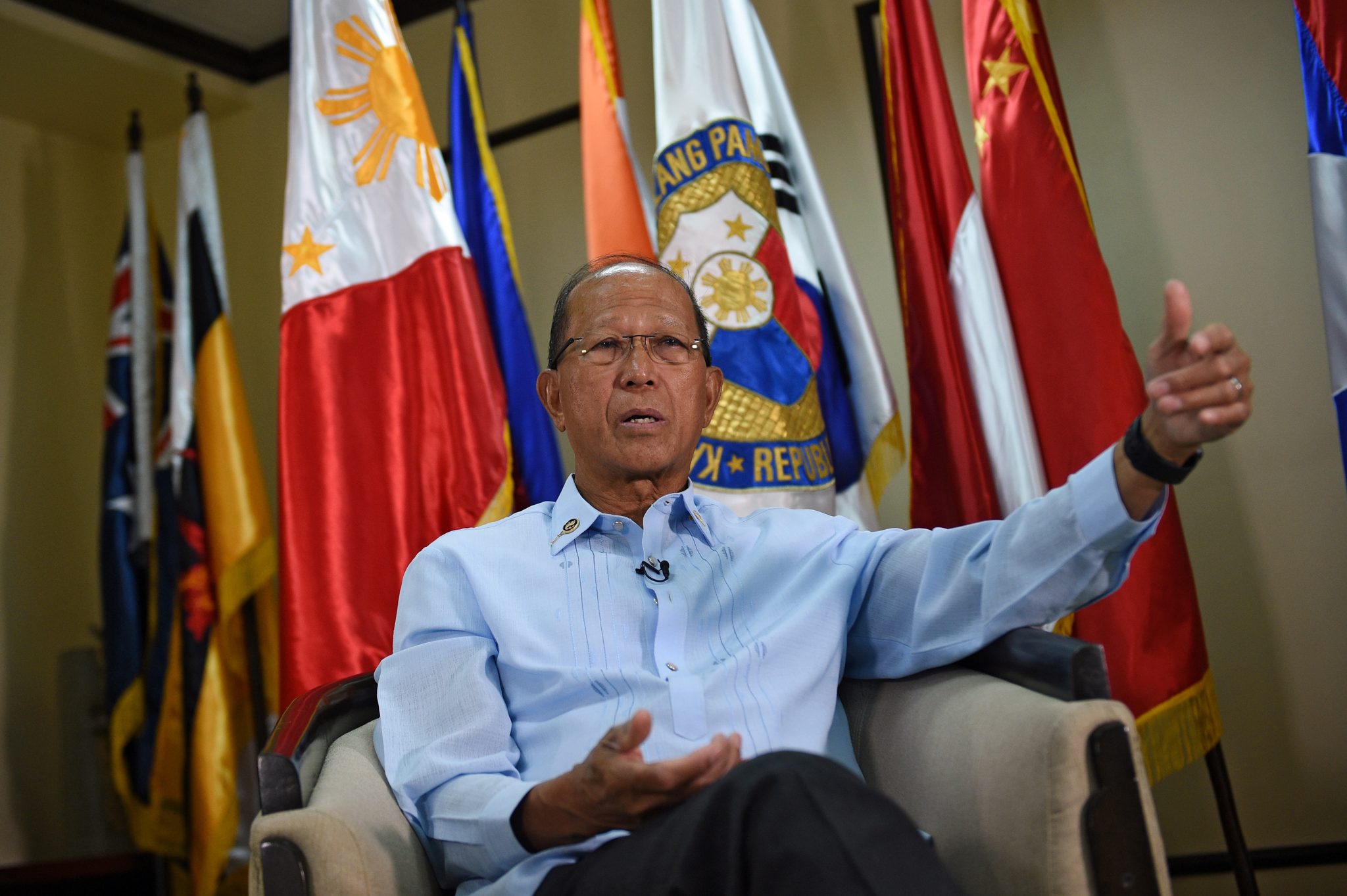 Philippine Defence Secretary Delfin Lorenzana takes part in an interview with AFP at the defence offices in Manila on February 7, 2017. Manila expects China to try to build on a reef off the coast of the Philippines, the country's defence secretary said February 7, adding this would be "unacceptable" in the flashpoint waterway. / AFP PHOTO / TED ALJIBE
