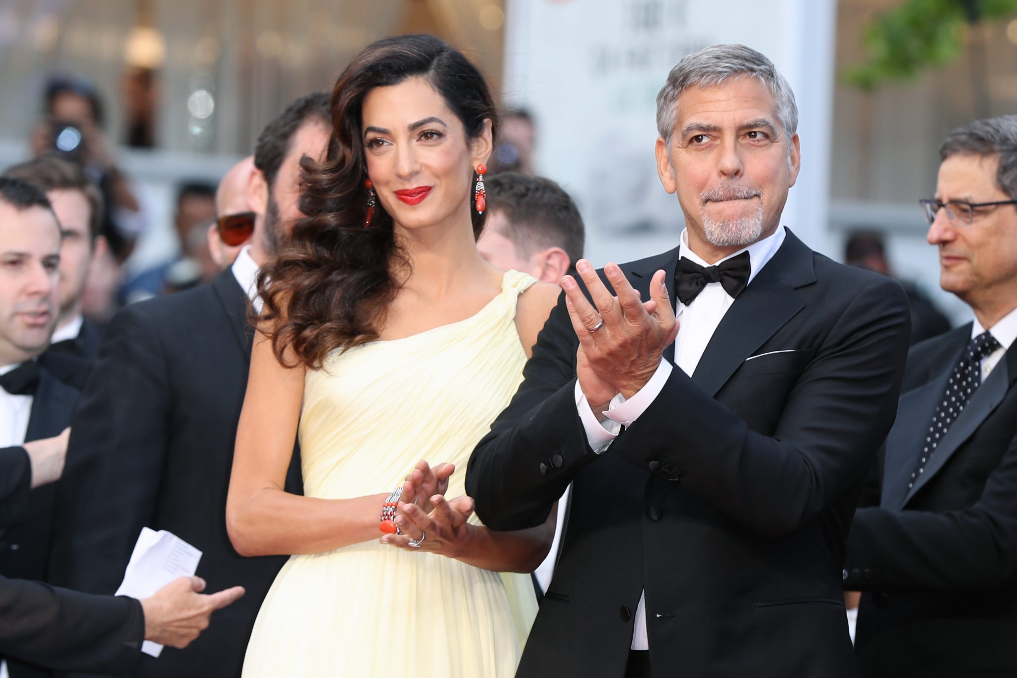 (FILES) This file photo taken on May 12, 2016 shows US actor George Clooney (R)and his wife British-Lebanese lawyer Amal Clooney arriving for the screening of the film "Money Monster" at the 69th Cannes Film Festival in Cannes, southern France. Amal Clooney, the prominent Lebanese-British human rights lawyer and wife of American actor George, is pregnant with twins, a family friend said on February 8, 2017. "She's pregnant with twins," the friend said, asking to remain anonymous and without providing any further details about the sexes of the babies or due date.The 39-year-old rights lawyer and 55-year-old Hollywood star tied the knot in Venice in 2014. / AFP PHOTO / Valery HACHE