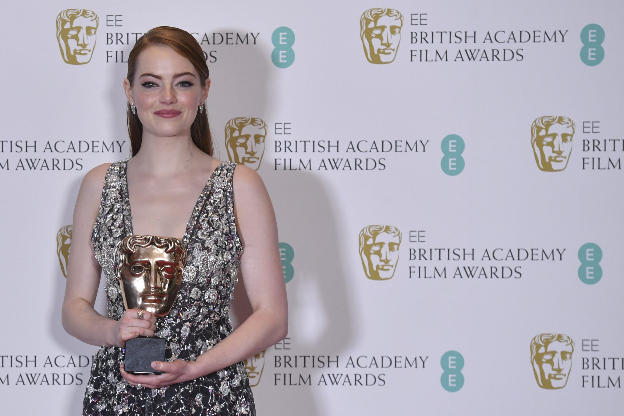US actress Emma Stone poses with the award for a Leading Actress for her work on the film 'La La Land' at the BAFTA British Academy Film Awards at the Royal Albert Hall in London on February 12, 2017.  / AFP PHOTO / Ben STANSALL