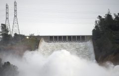 Water rushes down a spillway as an emergency measure at the Oroville Dam in Oroville, California on February 13, 2017.  Almost 200,000 people were under evacuation orders in northern California Monday after a threat of catastrophic failure at the United States' tallest dam. Officials said the threat had subsided for the moment as water levels at the Oroville Dam, 75 miles (120 kilometers) north of San Francisco, have eased. But people were still being told to stay out of the area.  / AFP PHOTO / Josh Edelson