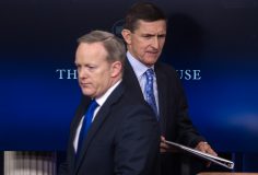 (FILES): This file photo taken on February 01, 2017 shows US National Security Adviser Mike Flynn (R) walking past Press Secretary Sean Spicer as he makes his way to the lectern during the daily press briefing at the White House in Washington, DC. The White House announced February 13, 2017 that Michael Flynn has resigned as President Donald Trump's national security advisor, amid escalating controversy over his contacts with Moscow. In his formal resignation letter, Flynn acknowledged that in the period leading up to Trump's inauguration: "I inadvertently briefed the vice president-elect and others with incomplete information regarding my phone calls with the Russian ambassador." / AFP PHOTO / NICHOLAS KAMM