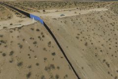 Aerial view of the metal fence between Mexico (L) and the United States (R) taken in Puerto Anapra, Chihuahua state, February 19, 2017.   ATTENTION EDITORS: This image is part of an ongoing AFP photo project documenting the life on the two sides of the US/Mexico border simultaneously by two photographers traveling for ten days from California to Texas on the US side and from Baja California to Tamaulipas on the Mexican side between February 13 and 22, 2017. You can find all the images with the keyword : BORDERPROJECT2017 on our wire and on www.afpforum.com / AFP PHOTO / YURI CORTEZ