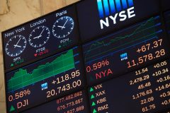 The video board is seen after the Dow Jones closing bell at the New York Stock Exchange, February 21, 2017 in New York. US stocks jumped with retailers and energy firms among the winners as positive sentiment about President Donald Trump's economic agenda again lifted the market to fresh records at the close. / AFP PHOTO / 30202530A / Bryan R. Smith