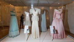 A collection of dresses made by desingers Regimes in 1979 (L), Bruce Oldfield in 1990 (C), and Catherine Walker in 1987, all worn by  worn by Britain's Diana, Princess of Wales in Hong Kong in 1989, are pictured during a press preview of the forthcoming exhibition entitled "Diana: Her Fashion Story", at Kensington Palace in London on February 22, 2017. Glittering gowns, elegant suits and bold mini-dresses worn by the late Princess Diana will go on show from Friday on the 20th anniversary of her death in a unique exhibition charting her style reign. "Diana: Her Fashion Story" follows her evolution from the demure outfits of her first public appearances to the glamourous gowns of her later life and is being hosted in Kensington Palace, her London residence. / AFP PHOTO / Daniel LEAL-OLIVAS
