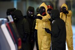 Members of Malaysia's Hazmat team conduct a decontamination operation at the departures terminal of the Kuala Lumpur International Airport 2 (KLIA 2) in Sepang on February 26, 2017. Kim Jong-Nam, the half-brother of North Korean leader Kim Jong-Un, was killed at the airport on February 13. Malaysian police told the public they would do everything possible to ensure there was no risk from the lethal VX nerve agent used to assassinate Kim Jong-Nam. / AFP PHOTO / MANAN VATSYAYANA / The erroneous mention[s] appearing in the metadata of this photo by MANAN VATSYAYANA has been modified in AFP systems in the following manner: [February 26] instead of [February 25]. Please immediately remove the erroneous mention[s] from all your online services and delete it (them) from your servers. If you have been authorized by AFP to distribute it (them) to third parties, please ensure that the same actions are carried out by them. Failure to promptly comply with these instructions will entail liability on your part for any continued or post notification usage. Therefore we thank you very much for all your attention and prompt action. We are sorry for the inconvenience this notification may cause and remain at your disposal for any further information you may require.
