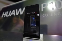 Picture shows Chinese multinational networking and telecommunications equipment and services company Huawei's new phone P10 after its presentation on February 26, 2017 in Barcelona on the eve of the start of the Mobile World Congress. Phone makers will seek to seduce new buyers with even smarter Internet-connected watches and other wireless gadgets as they wrestle for dominance at the world's biggest mobile fair starting tomorrow. / AFP PHOTO / LLUIS GENE