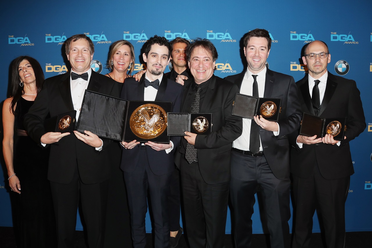BEVERLY HILLS, CA - FEBRUARY 04: Director Damien Chazelle (C), winner of the Directors Guild of America Award for Outstanding Directorial Achievement in Feature Film for La La Land,' poses with members of his directing team in the press room during the 69th Annual Directors Guild of America Awards at The Beverly Hilton Hotel on February 4, 2017 in Beverly Hills, California. Frederick M. Brown/Getty Images/AFP