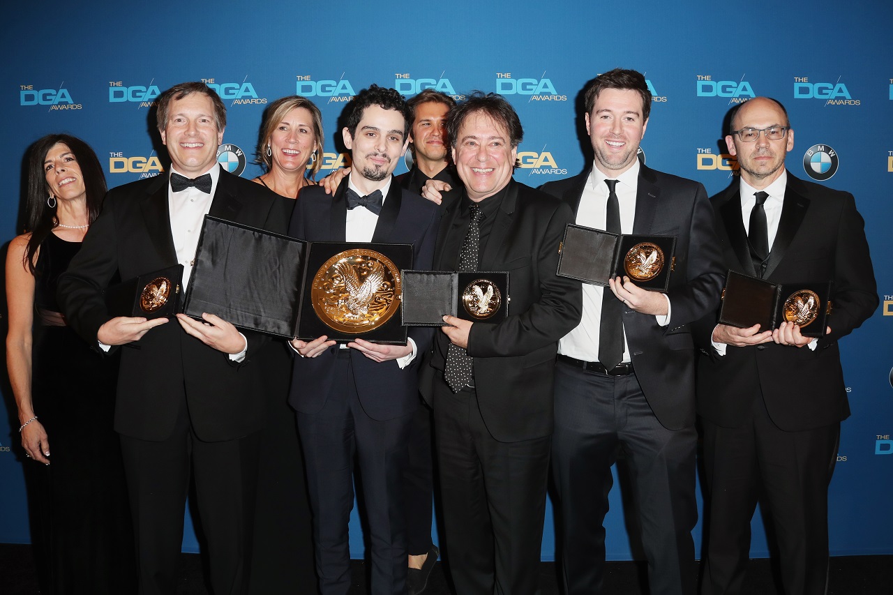 BEVERLY HILLS, CA - FEBRUARY 04: Director Damien Chazelle (C), winner of the Directors Guild of America Award for Outstanding Directorial Achievement in Feature Film for La La Land,' poses with members of his directing team in the press room during the 69th Annual Directors Guild of America Awards at The Beverly Hilton Hotel on February 4, 2017 in Beverly Hills, California.   Frederick M. Brown/Getty Images/AFP