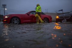 SUN VALLEY, CA - FEBRUARY 17: A firefighter checks on stalled cars in a flooded street as a powerful storm moves across Southern California on February 17, 2017 in Sun Valley, California. After years of severe drought, heavy winter rains have come to the state, and with them, the issuance of flash flood watches in Santa Barbara, Ventura and Los Angeles counties, and the evacuation of hundreds of residents from Duarte, California for fear of flash flooding from area denuded by a wildfire last year. David McNew/Getty Images/AFP