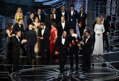 HOLLYWOOD, CA - FEBRUARY 26: 'La La Land' producer Jordan Horowitz (L) holds up the winner card reading actual Best Picture winner 'Moonlight' with actor Warren Beatty onstage during the 89th Annual Academy Awards at Hollywood & Highland Center on February 26, 2017 in Hollywood, California. Kevin Winter/Getty Images/AFP