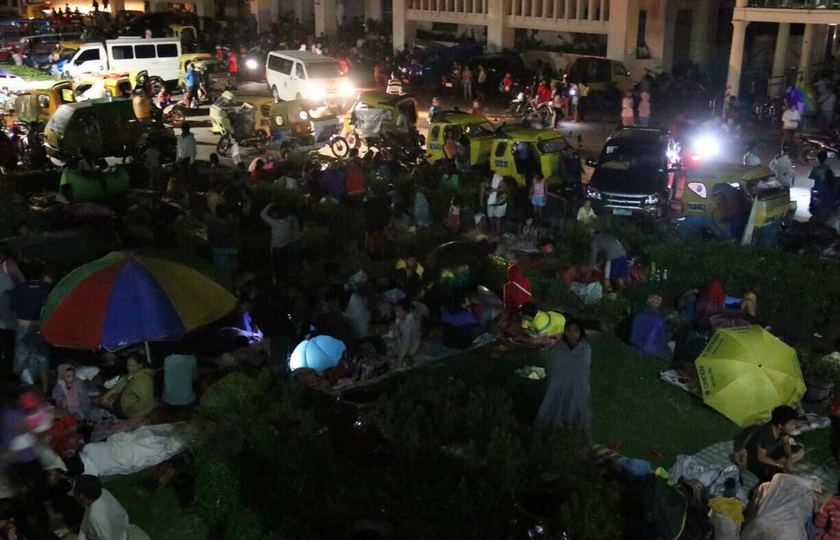 Residents of 28 barangays in Surigao del Norte affected by the earthquake gather at open spaces to seek temporary shelter.  (Photo courtesy Presidential Communications office)