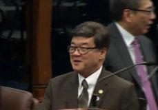 Justice Secretary Vitaliano Aguirre II smiles as he is congratulated by senators and lawmakers after he was confirmed at the Commission on Appointments.