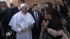 Pope Francis receives two copies of the Pasugo (God's Message) magazine from a Filipino student at Roman Tre Univeristy, Klein Mendiola who is also a member of the Iglesia Ni Cristo (Photo grabbed from Centro Televisivo Vaticano, CTV)