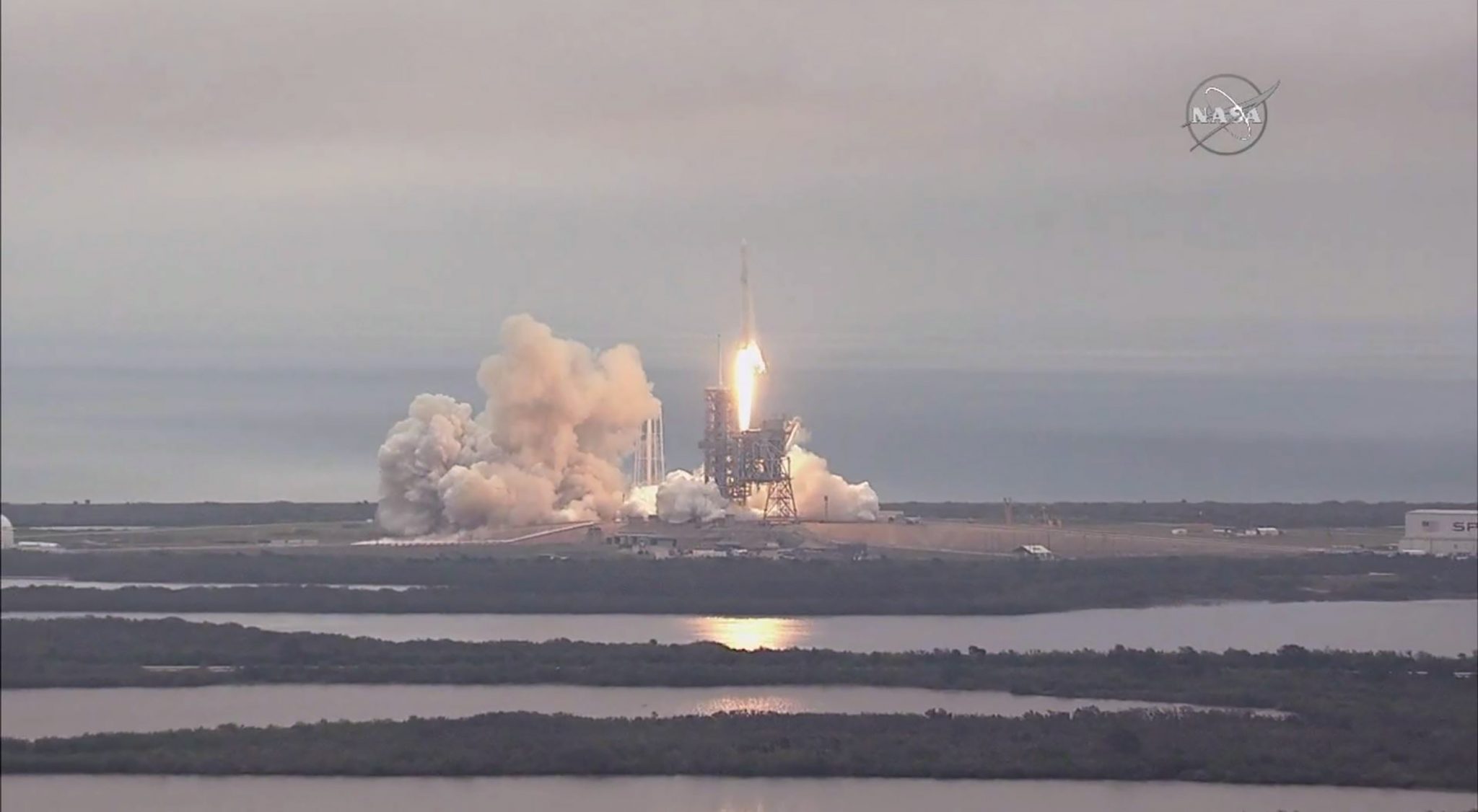 FILE PHOTO: This still image taken from NASA TV, shows the the SpaceX Falcon 9 rocket, carrying a Dragon cargo capsule, launching from the Kennedy Space Center Launch Complex 39A in Florida on February 19, 2017. The current resupply mission is the 10th of up to 20 planned trips to the International Space Station. The unmanned cargo capsule is packed with more than 5,000 pounds (2,267 kilograms) of food, gear and science experiments. Launchpad 39A was used for the Apollo and space shuttle launches. / AFP PHOTO / NASA / HO / RESTRICTED TO EDITORIAL USE - MANDATORY CREDIT "AFP PHOTO / NASA" - NO MARKETING NO ADVERTISING CAMPAIGNS - DISTRIBUTED AS A SERVICE TO CLIENTS