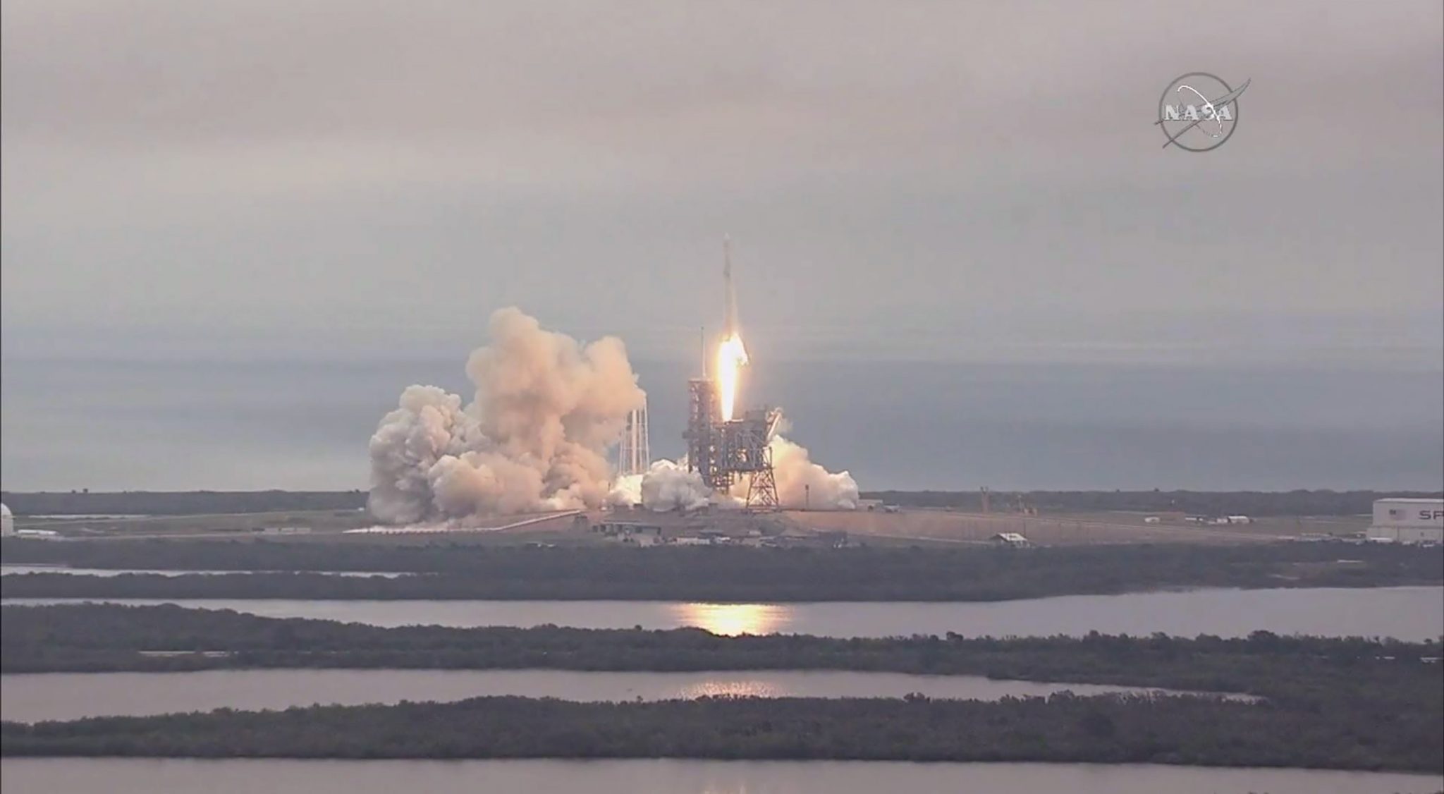 FILE PHOTO: This still image taken from NASA TV, shows the the SpaceX Falcon 9 rocket, carrying a Dragon cargo capsule, launching from the Kennedy Space Center Launch Complex 39A in Florida on February 19, 2017. The current resupply mission is the 10th of up to 20 planned trips to the International Space Station. The unmanned cargo capsule is packed with more than 5,000 pounds (2,267 kilograms) of food, gear and science experiments. Launchpad 39A was used for the Apollo and space shuttle launches. / AFP PHOTO / NASA / HO / RESTRICTED TO EDITORIAL USE - MANDATORY CREDIT "AFP PHOTO / NASA" - NO MARKETING NO ADVERTISING CAMPAIGNS - DISTRIBUTED AS A SERVICE TO CLIENTS